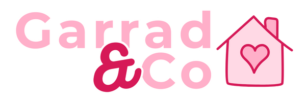 Logo of Garrad & Co with a pink house and heart on a white background